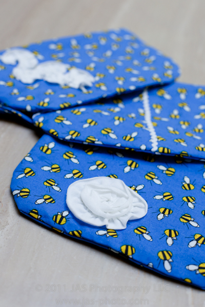 cute wristlets made with whimisical fabric as a teacher's thankyou gift with flower and ric rac embellishments