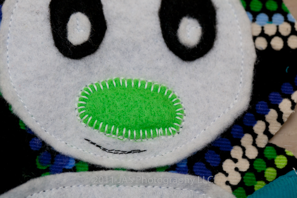 traditional applique stitching for nose on stuffed penguin