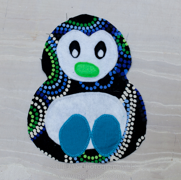 one completed front of stuffed penguin