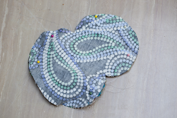 stuffed penguing pinned together before sewing