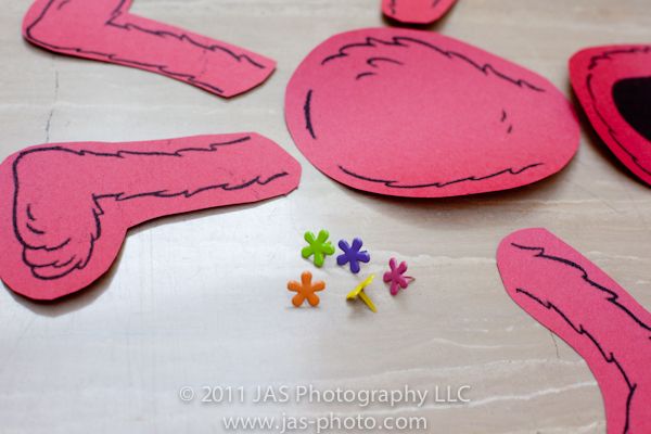 cute flower fasteners to attach limbs of build your elmo for elmo party theme activity